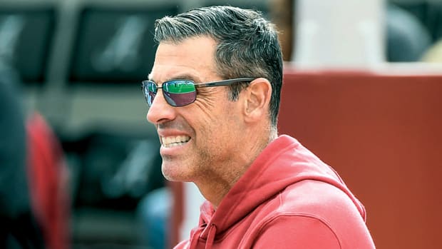 Razorbacks offensive coordinator Dan Enos on sidelines against Alabama.